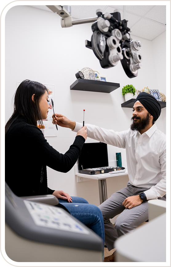 Dr. Minhas performing an eye exam
