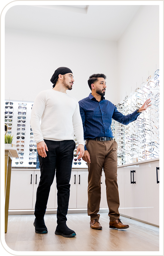 Two men looking at a display of eyeglasses