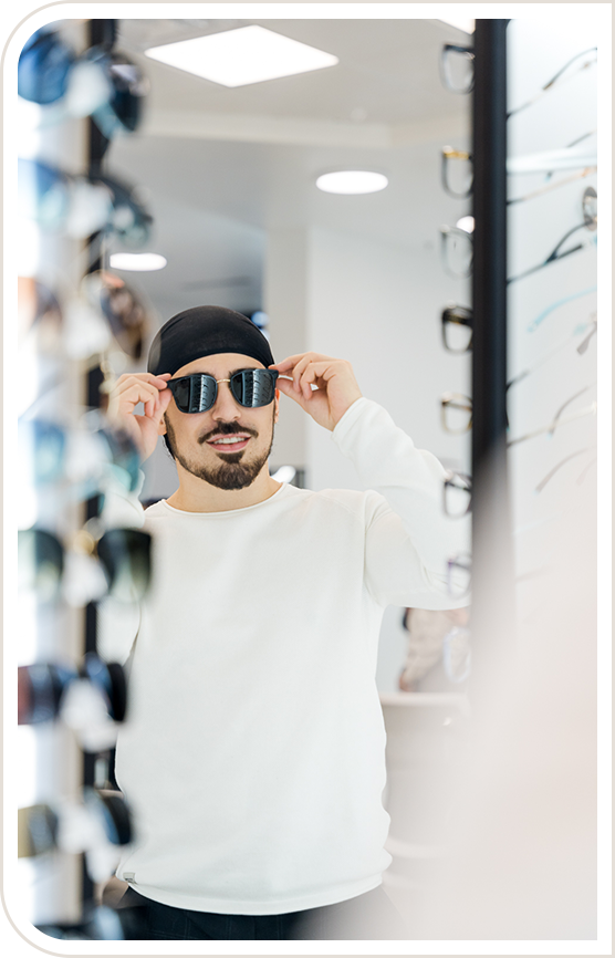 Man trying on sunglasses