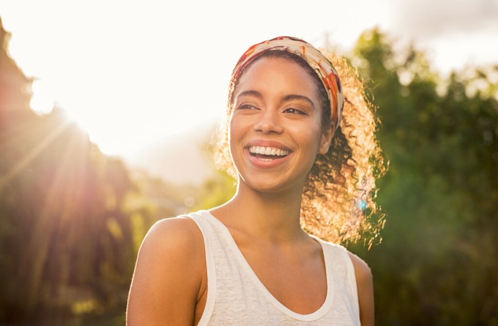 Happy young woman outside on a sunny afternoon.