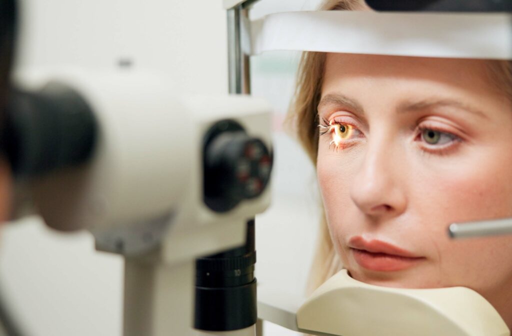 Close-up of an eye exam using a diagnostic laser device.
