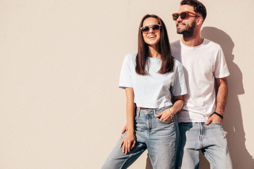 Couple wearing sunglasses uv protection outdoors.