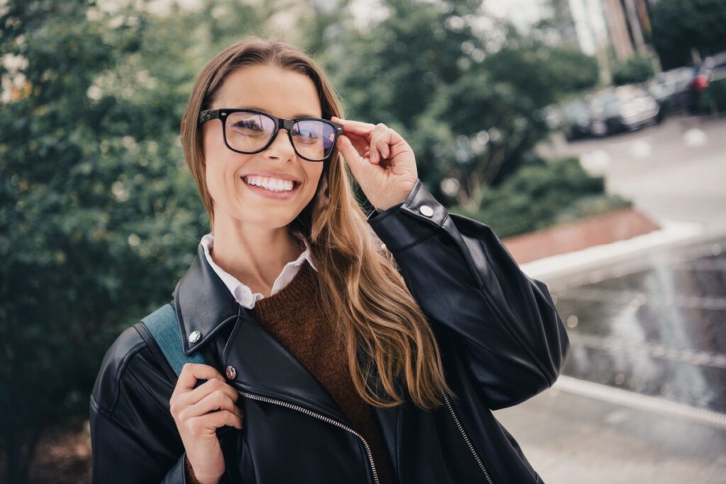Woman wearing eyeglasses outdoors urban setting